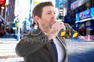 Composite image of focused handsome businessman holding binocula