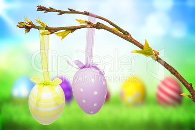 Composite image of hanging easter eggs