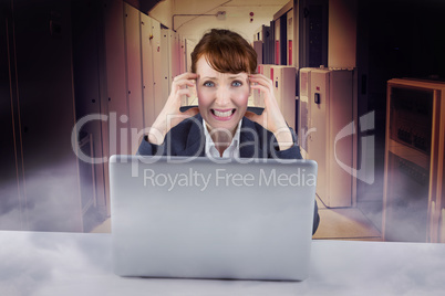 Composite image of stressed businesswoman