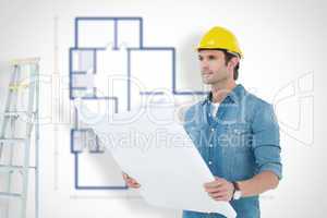 Composite image of architect holding blueprint in house