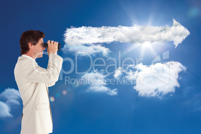 Composite image of businessman using binoculars