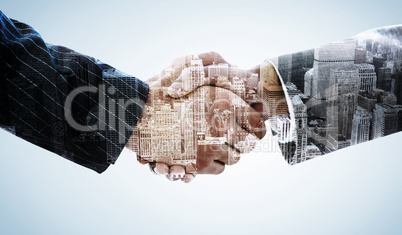 Composite image of business people shaking hands