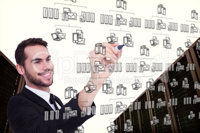 Composite image of smiling businessman writing with black marker