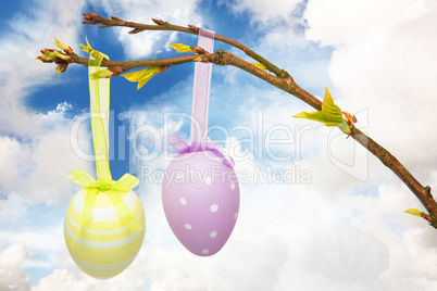 Composite image of hanging easter eggs