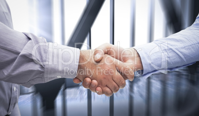 Composite image of men shaking hands