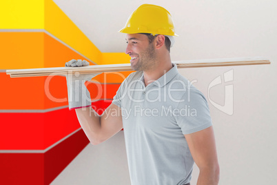 Composite image of worker with plank of wood