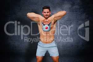 Composite image of bodybuilder holding kettlebell