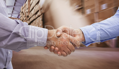 Composite image of men shaking hands