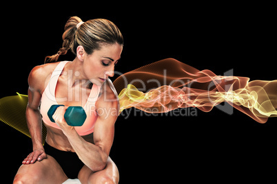 Composite image of strong woman doing bicep curl with blue dumbb