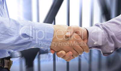 Composite image of two men shaking hands