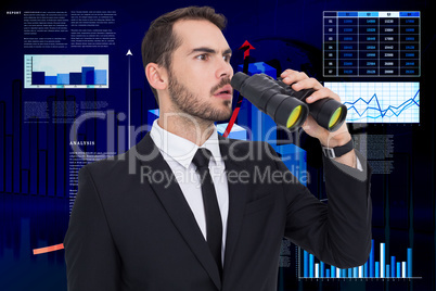 Composite image of surprised businessman standing and holding bi