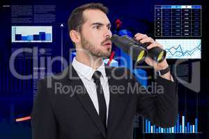 Composite image of surprised businessman standing and holding bi