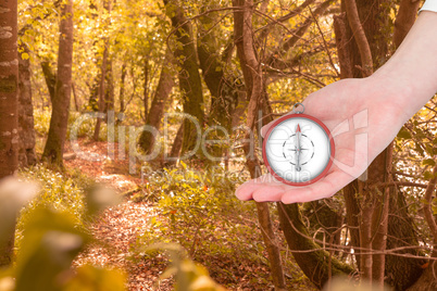 Composite image of businesswomans hand presenting