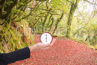 Composite image of close up of businessman with hand open