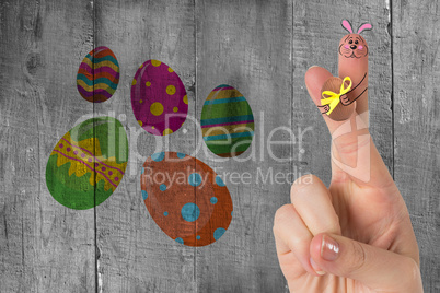 Composite image of fingers as easter bunny