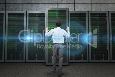 Composite image of businessman posing with hands up