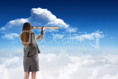 Composite image of businesswoman looking through a telescope