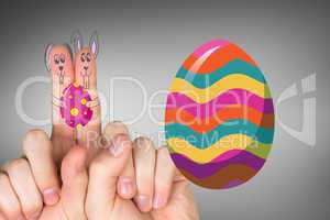 Composite image of fingers as easter bunny