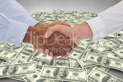 Composite image of close-up shot of a handshake in office