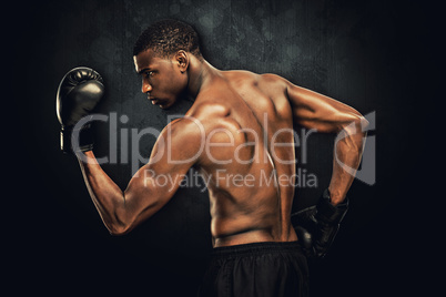 Composite image of muscular boxer