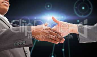 Composite image of businessman going shaking a hand