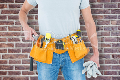 Composite image of technician holding gloves and hammer