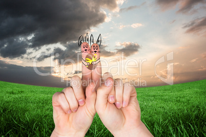 Composite image of fingers as easter bunny