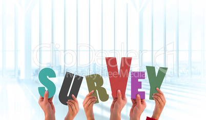Composite image of hands holding up survey