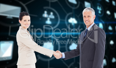 Composite image of smiling business people shaking hands while l