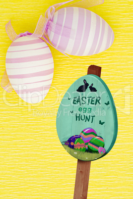 Composite image of easter egg hunt sign