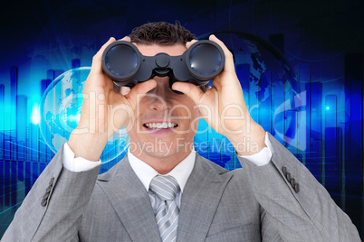 Composite image of businessman holding binoculars