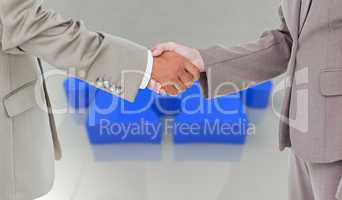 Composite image of side view of shaking hands