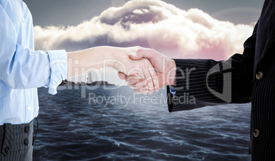 Composite image of close up of a business people closing a deal