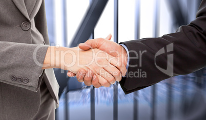 Composite image of close up of two businesspeople shaking their