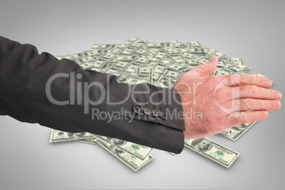 Composite image of businessman reaching hand out