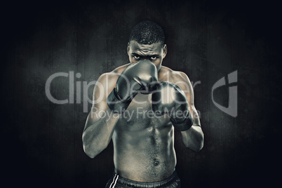 Composite image of muscular boxer