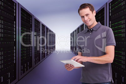 Composite image of smiling young man with tablet computer