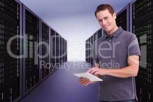 Composite image of smiling young man with tablet computer