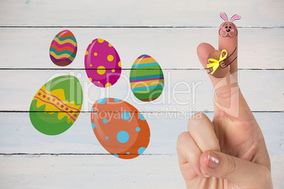 Composite image of fingers as easter bunny