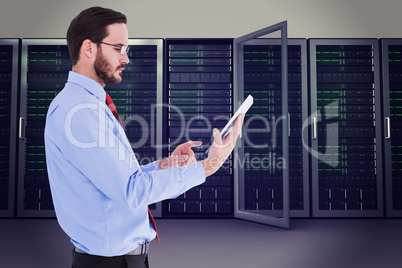 Composite image of businessman scrolling on his digital tablet