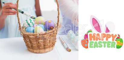 Composite image of happy mother and daughter painting easter egg