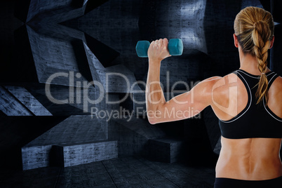 Composite image of female bodybuilder holding a blue dumbbell