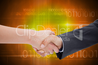 Composite image of close up of a handshake