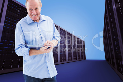 Composite image of happy mature man using his tablet pc