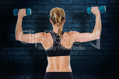 Composite image of female bodybuilder holding two dumbbells with