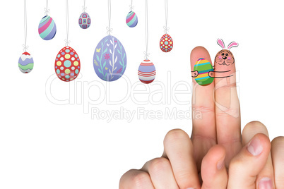 Composite image of fingers as easter bunny