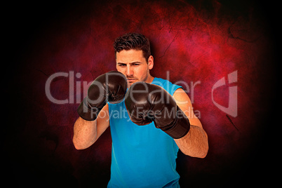 Composite image of determined male boxer focused on his training