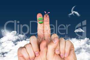 Composite image of fingers as easter bunny