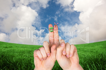 Composite image of fingers as easter bunny