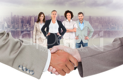 Composite image of side view of shaking hands